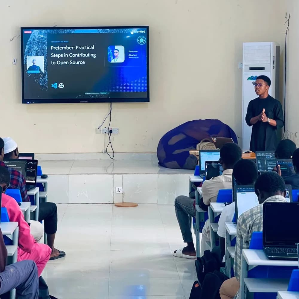 Giving the talk “Pretember: Practical Steps in Contributing to Open Source” to a room of developers at VS Code Dev Days Minna